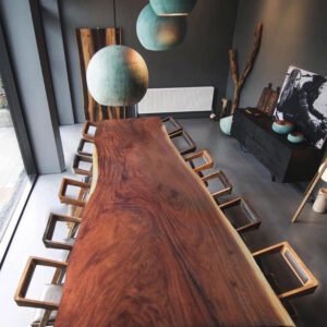 A magnificent 350 cm long Suar wood tabletop with a unique slab featuring an organic trunk shape.